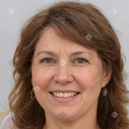 Joyful white adult female with long  brown hair and brown eyes