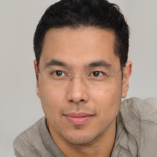 Neutral latino adult male with short  brown hair and brown eyes