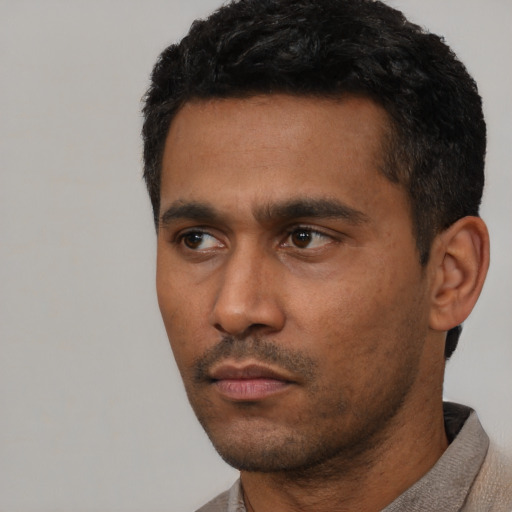 Neutral latino adult male with short  black hair and brown eyes