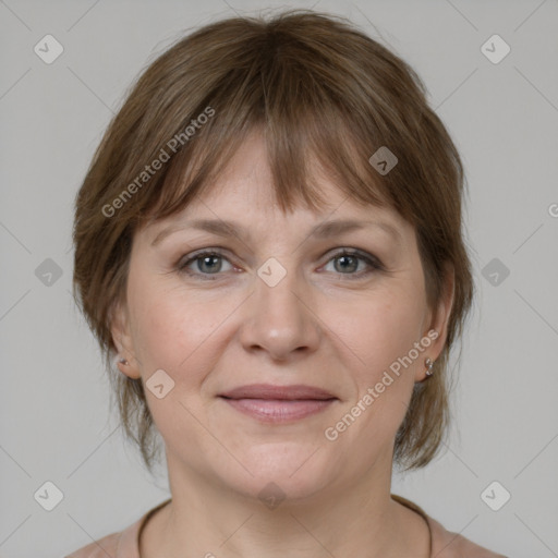 Joyful white young-adult female with medium  brown hair and grey eyes