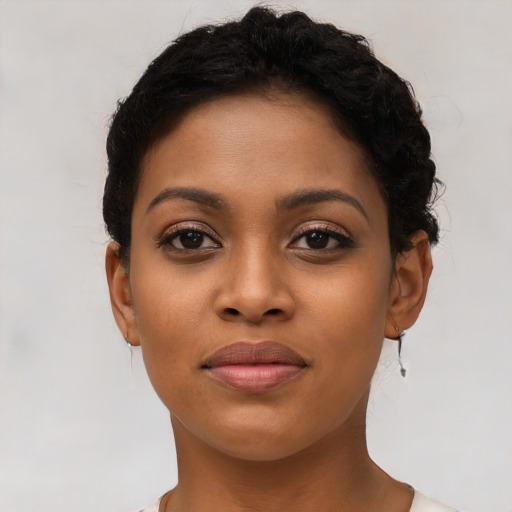 Joyful latino young-adult female with short  brown hair and brown eyes