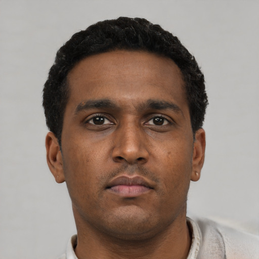 Neutral black young-adult male with short  black hair and brown eyes