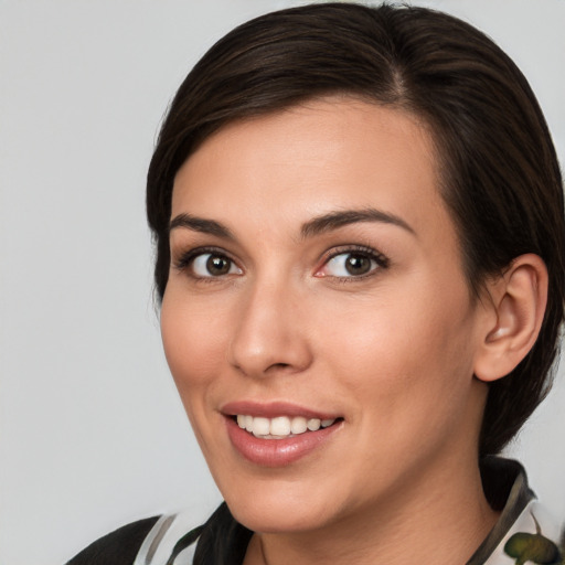 Joyful white young-adult female with medium  brown hair and brown eyes