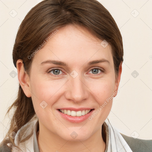 Joyful white young-adult female with medium  brown hair and grey eyes