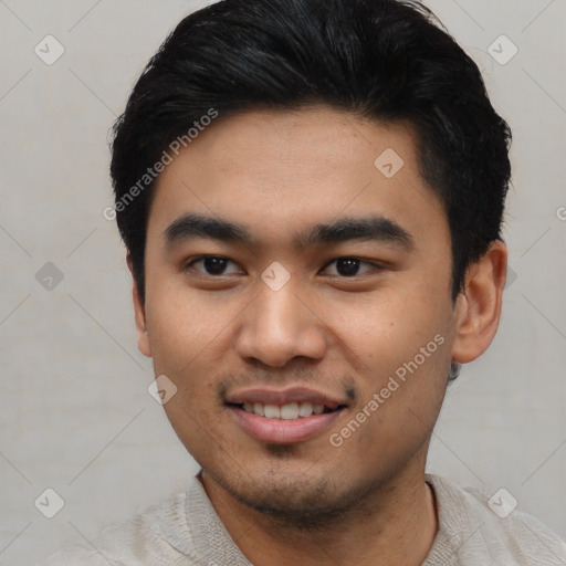 Joyful asian young-adult male with short  black hair and brown eyes