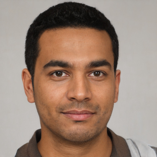 Neutral latino young-adult male with short  black hair and brown eyes