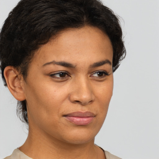 Joyful latino young-adult female with short  brown hair and brown eyes