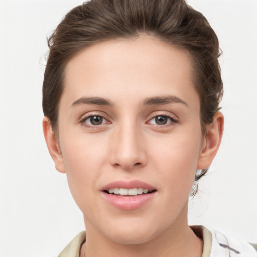 Joyful white young-adult female with medium  brown hair and grey eyes