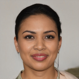 Joyful latino young-adult female with short  brown hair and brown eyes