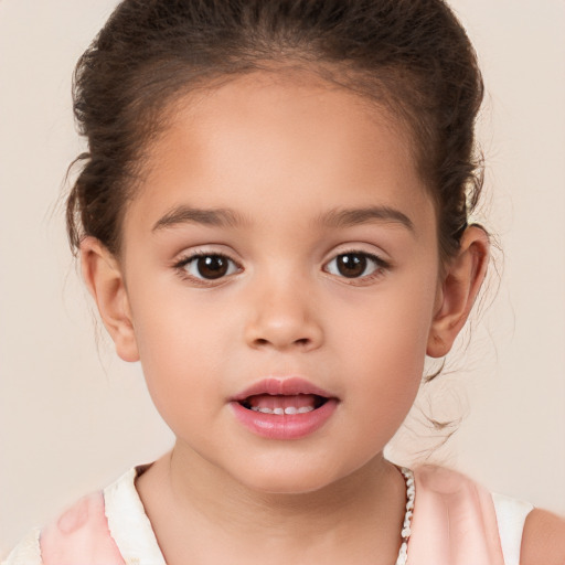 Joyful white child female with short  brown hair and brown eyes