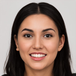 Joyful white young-adult female with long  black hair and brown eyes