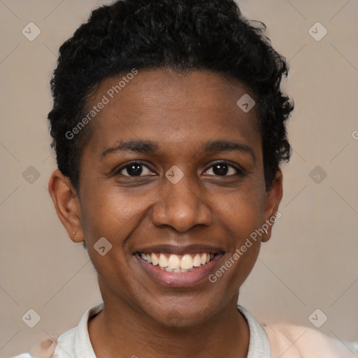 Joyful black young-adult female with short  black hair and brown eyes