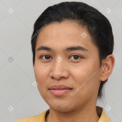 Joyful asian young-adult female with short  black hair and brown eyes