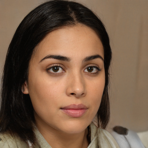 Neutral latino young-adult female with medium  brown hair and brown eyes