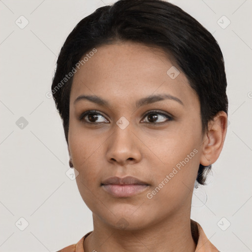 Neutral black young-adult female with short  black hair and brown eyes