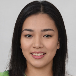 Joyful asian young-adult female with long  brown hair and brown eyes