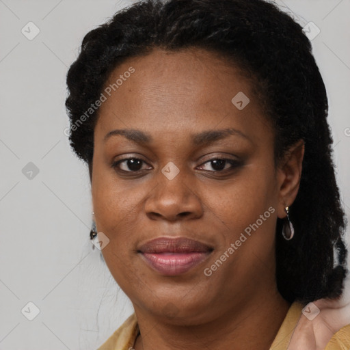 Joyful black adult female with short  brown hair and brown eyes