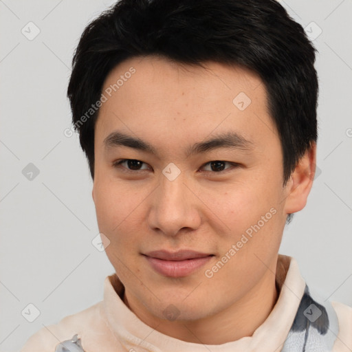 Joyful asian young-adult male with short  black hair and brown eyes