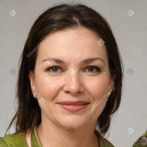 Joyful white adult female with medium  brown hair and brown eyes