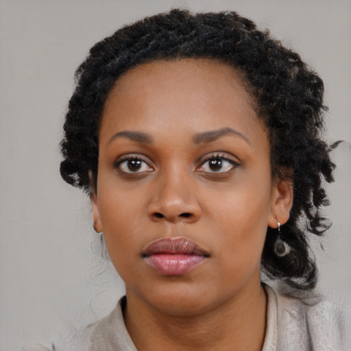 Neutral black young-adult female with medium  black hair and brown eyes