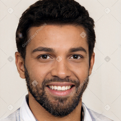 Joyful black young-adult male with short  black hair and brown eyes