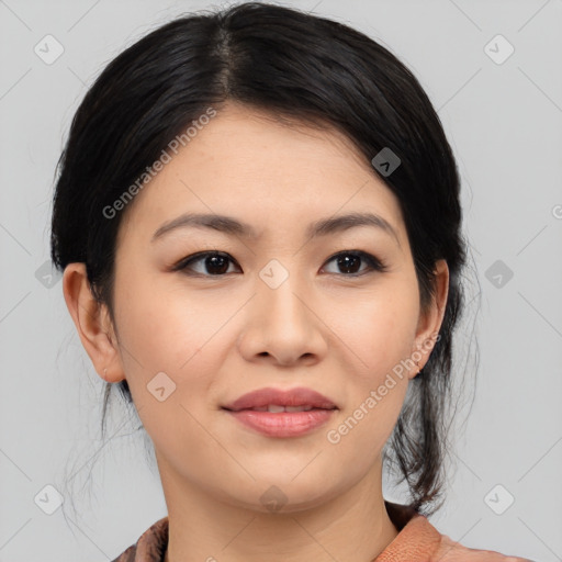 Joyful asian young-adult female with medium  black hair and brown eyes