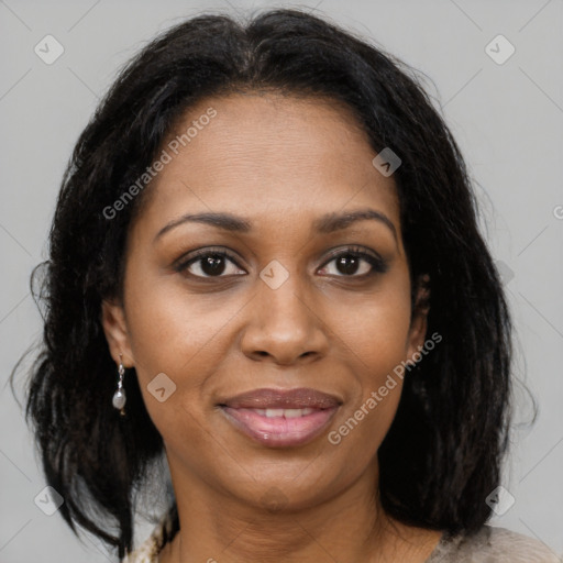 Joyful black adult female with medium  brown hair and brown eyes