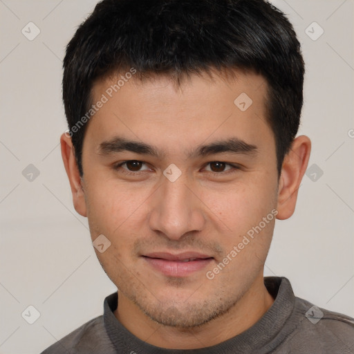 Joyful white young-adult male with short  black hair and brown eyes