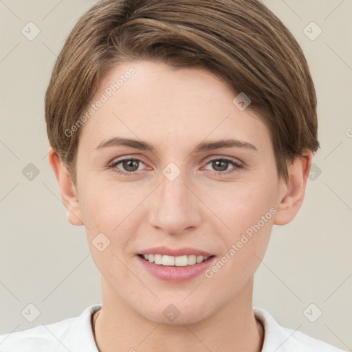 Joyful white young-adult female with short  brown hair and grey eyes