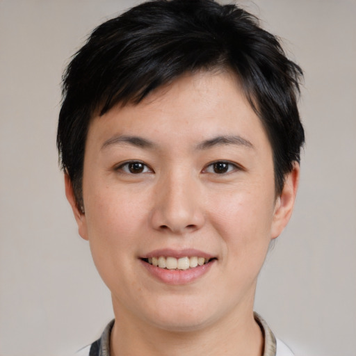 Joyful white young-adult female with short  black hair and brown eyes
