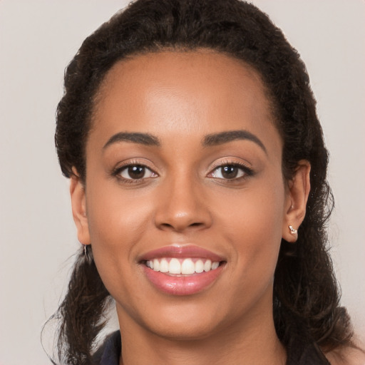 Joyful white young-adult female with long  brown hair and brown eyes