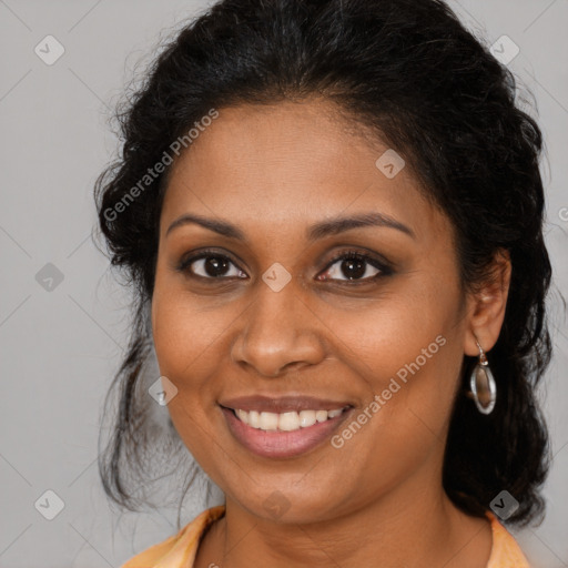 Joyful black young-adult female with long  brown hair and brown eyes
