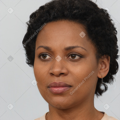 Joyful black adult female with short  black hair and brown eyes