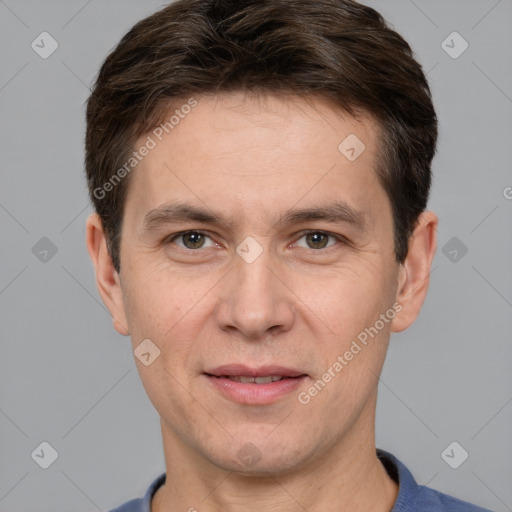 Joyful white adult male with short  brown hair and grey eyes