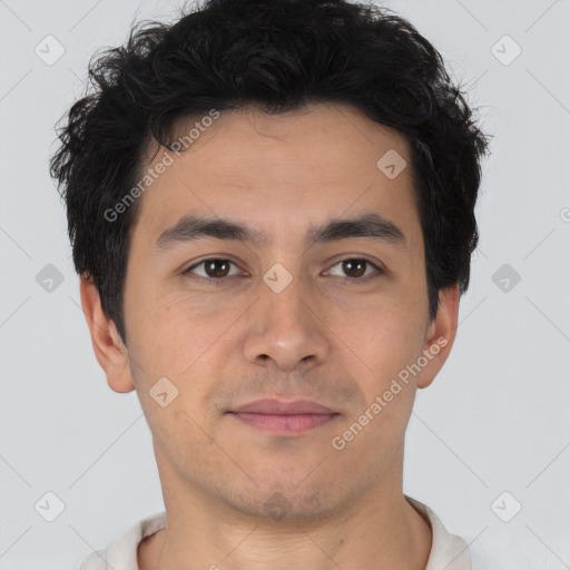 Joyful latino young-adult male with short  brown hair and brown eyes