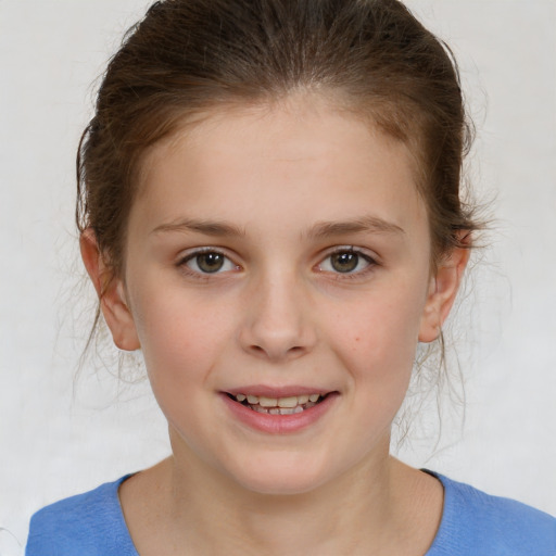 Joyful white child female with medium  brown hair and brown eyes