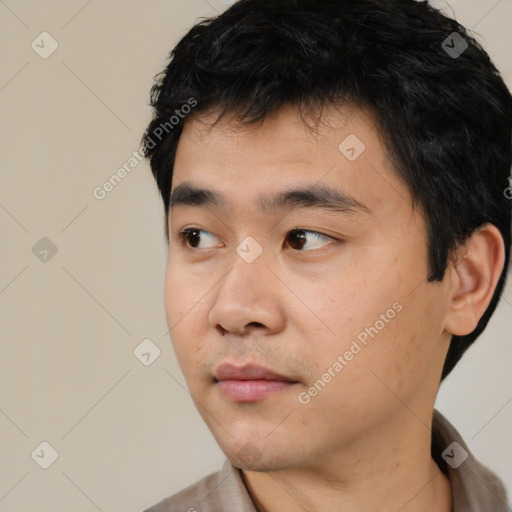 Neutral asian young-adult male with short  black hair and brown eyes