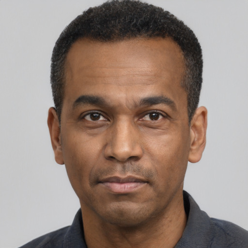 Neutral latino adult male with short  black hair and brown eyes