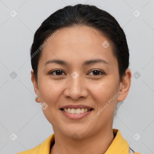 Joyful latino young-adult female with short  brown hair and brown eyes