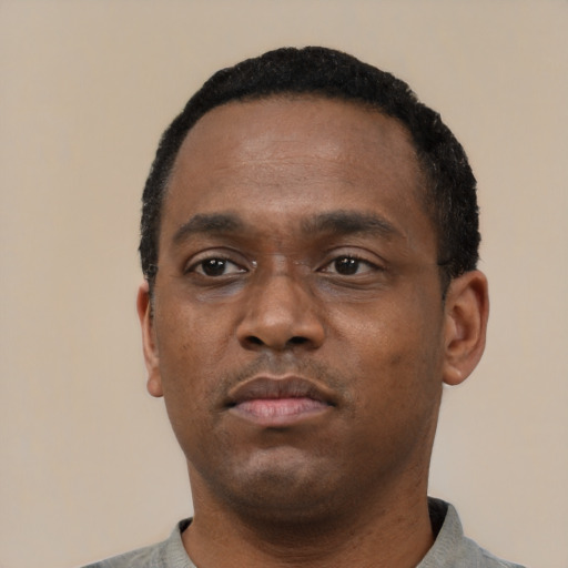Neutral latino adult male with short  black hair and brown eyes