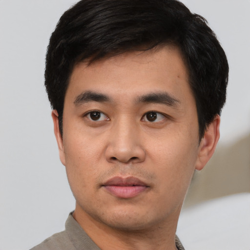 Neutral white young-adult male with short  black hair and brown eyes