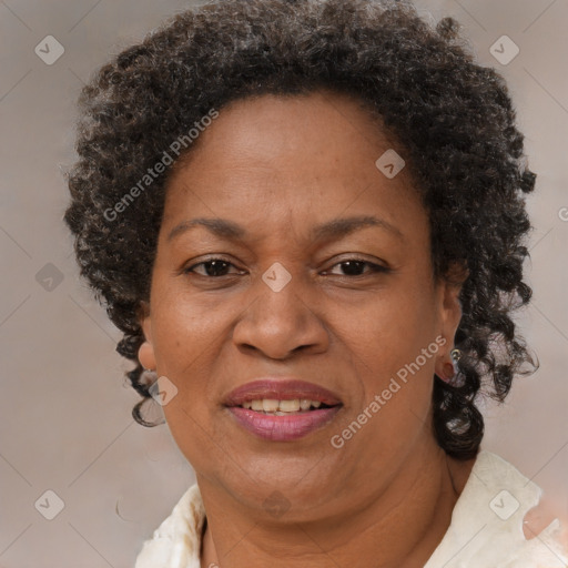 Joyful black adult female with short  brown hair and brown eyes