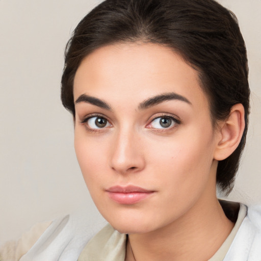 Neutral white young-adult female with medium  brown hair and brown eyes