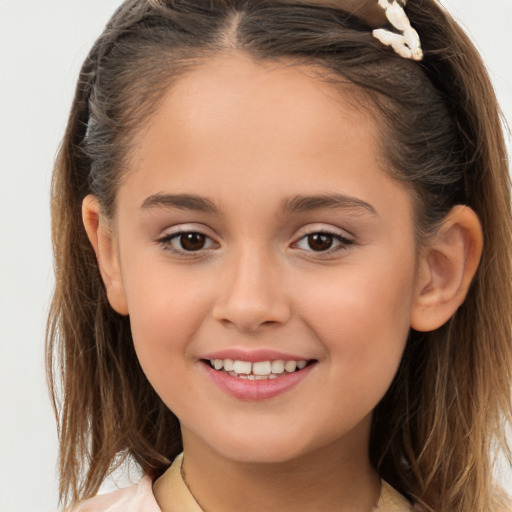 Joyful white child female with long  brown hair and brown eyes