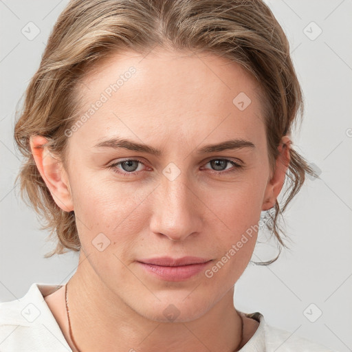 Joyful white young-adult female with medium  brown hair and blue eyes