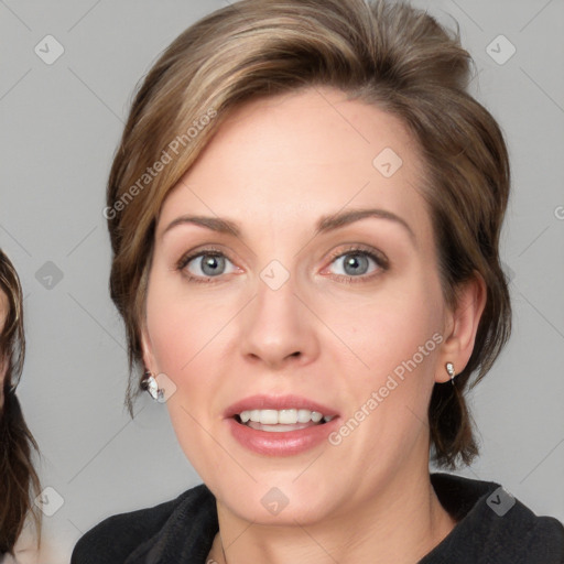 Joyful white adult female with medium  brown hair and blue eyes