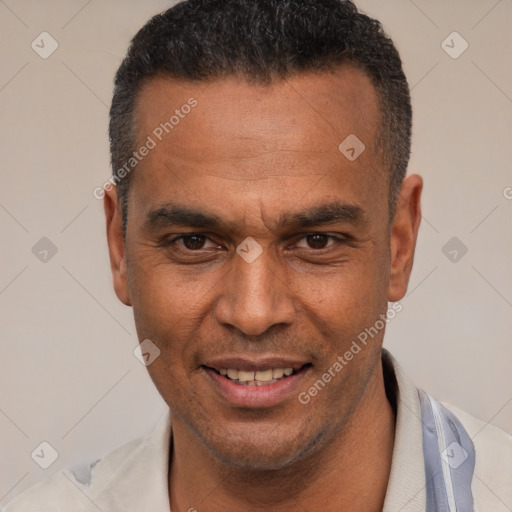 Joyful latino adult male with short  black hair and brown eyes