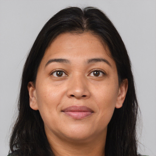 Joyful asian young-adult female with long  brown hair and brown eyes