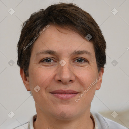 Joyful white adult female with short  brown hair and brown eyes