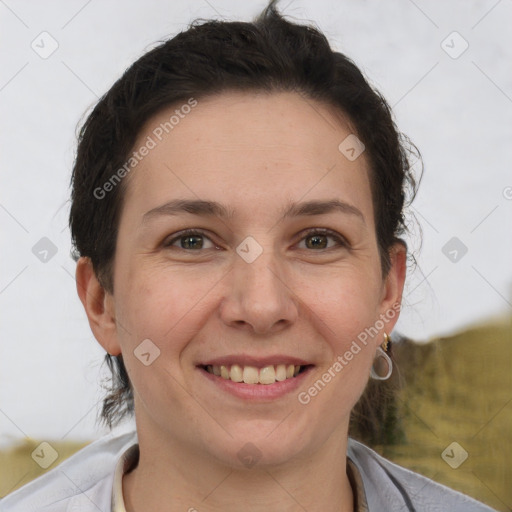 Joyful white adult female with short  brown hair and brown eyes